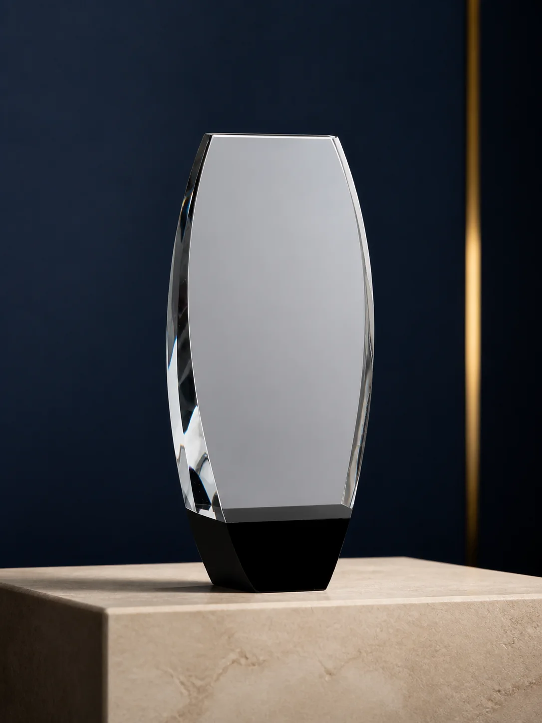 Clear crystal corporate award displayed on a stone plinth