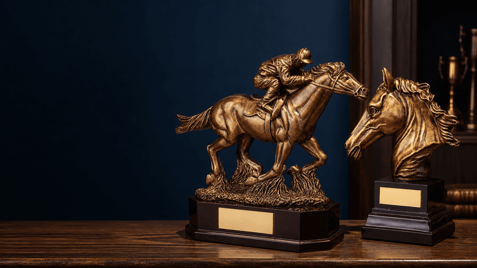 Bronze equestrian trophies displayed in a heritage workshop