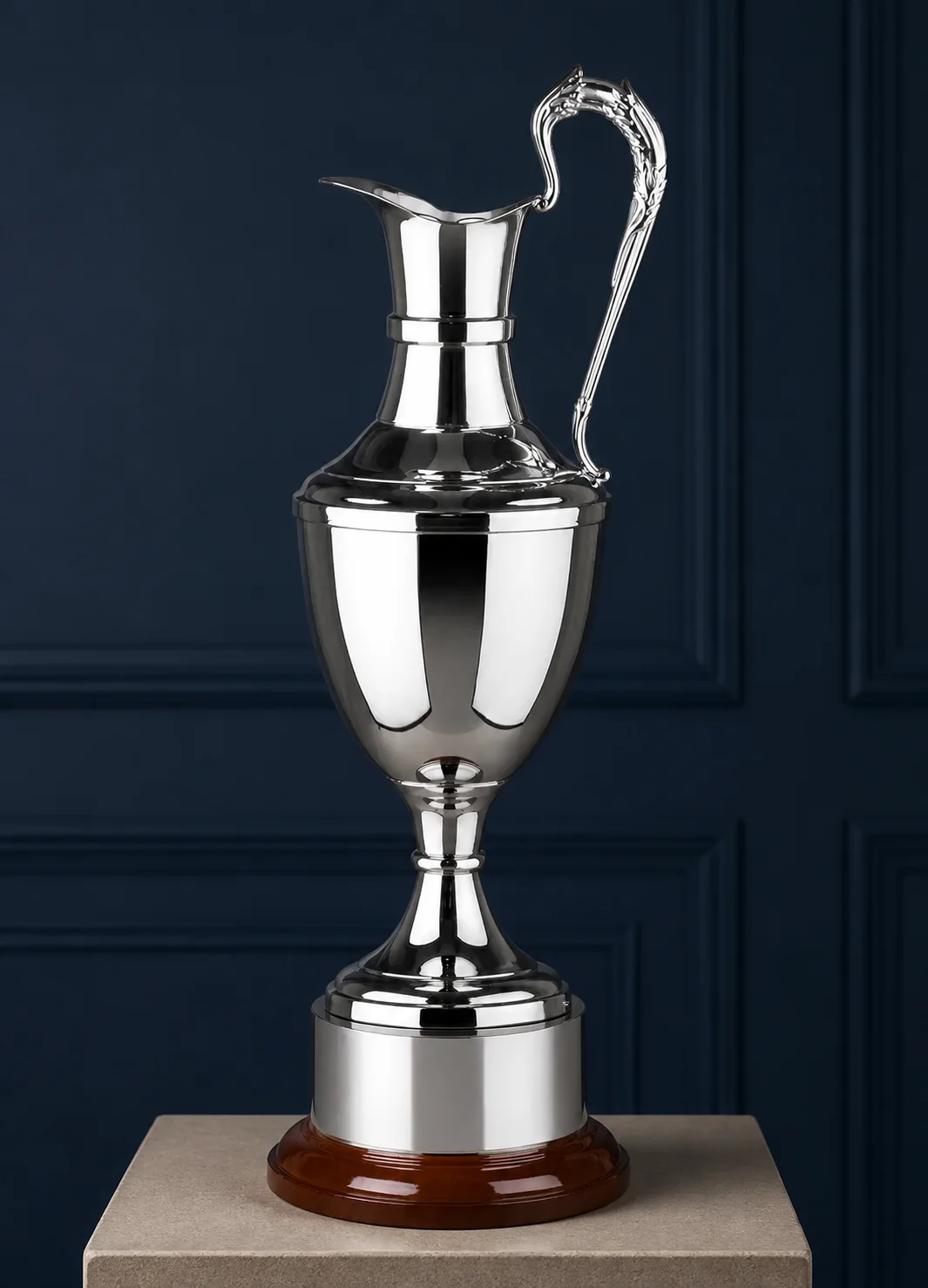 Tall polished silver ewer in a traditional presentation setting